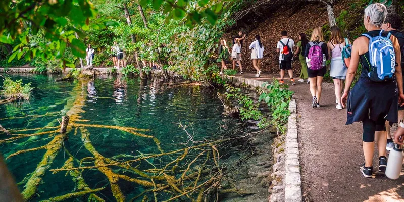 Footbridge over a waterfall on a Plitvice Lakes National Park tour from Split, Croatia